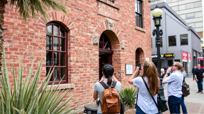 Photography tour group exploring historic downtown Tucson architecture.
